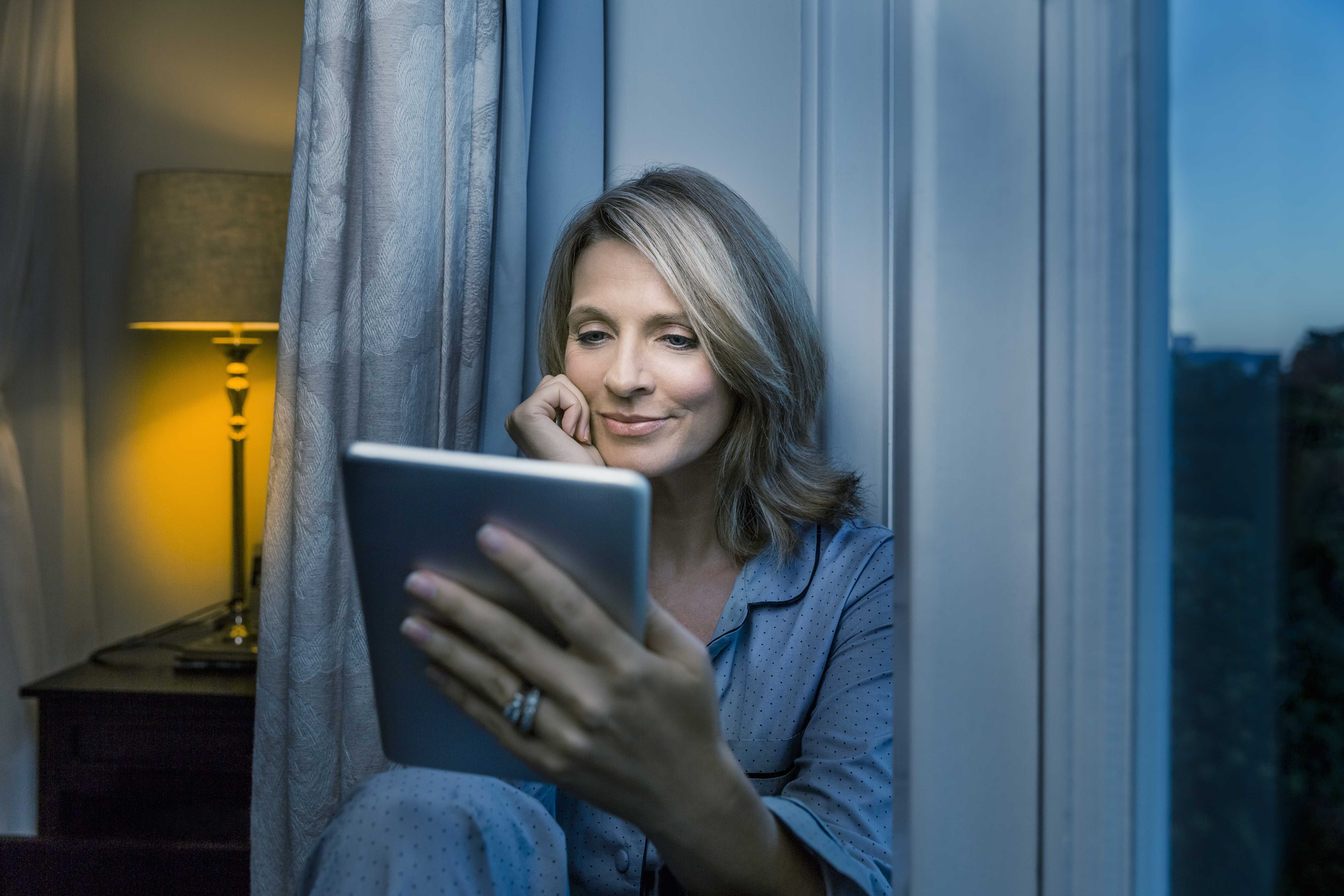 Woman viewing tablet