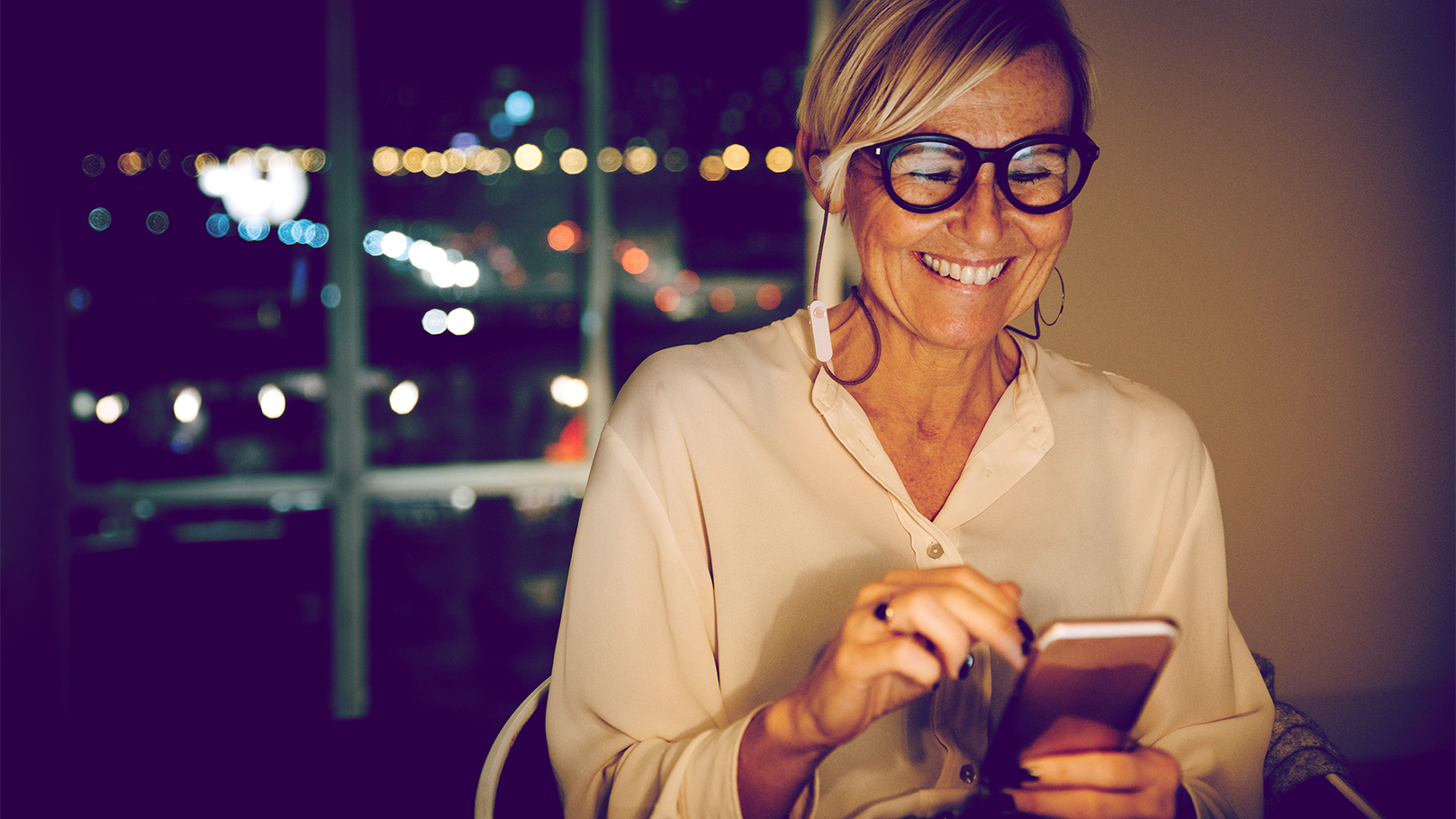woman using her face to unlock her banking