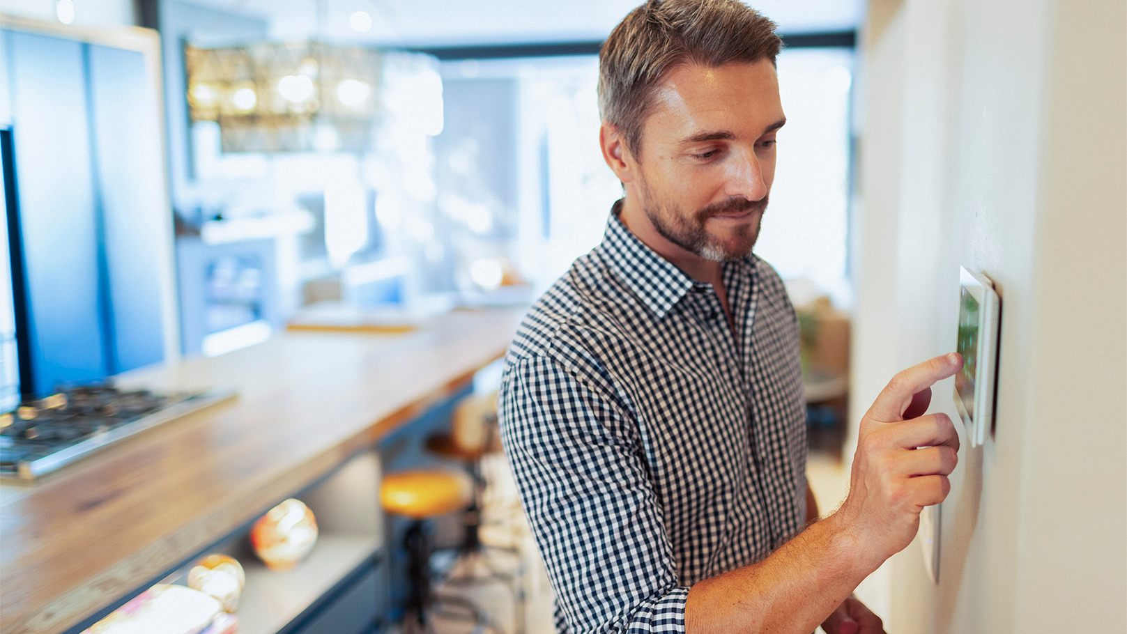 man using an eco-friendly energy controller