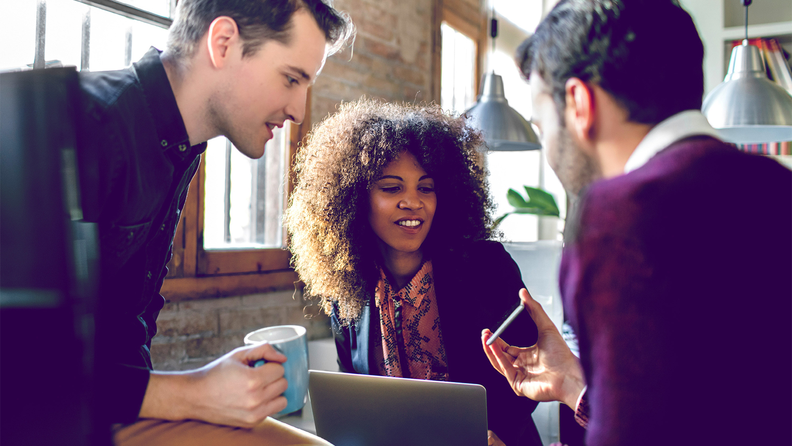 group using their phones to unlock their banking
