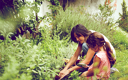 Woman and her child in the garden